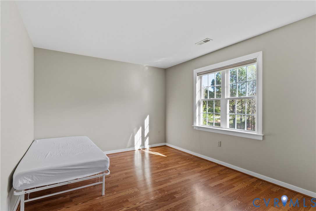 15286 Devonwood Road Montpelier, VA 23192 - Photo 36 of 50 Unfurnished bedroom featuring wood finished floors