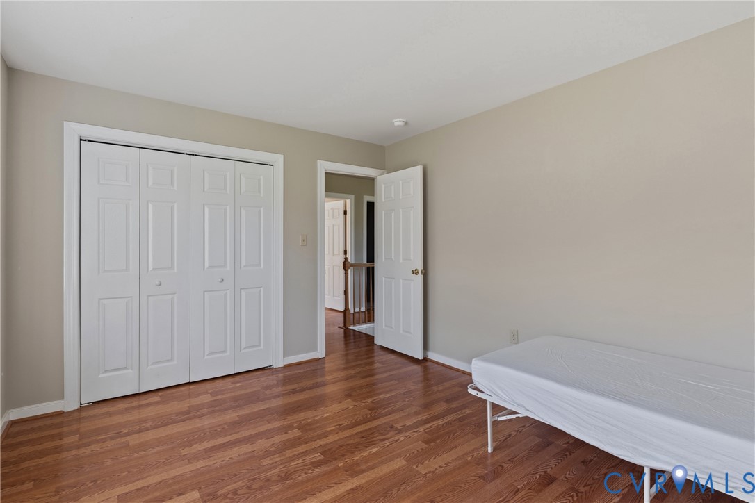 15286 Devonwood Road Montpelier, VA 23192 - Photo 37 of 50 Bedroom featuring a closet and wood finished floor