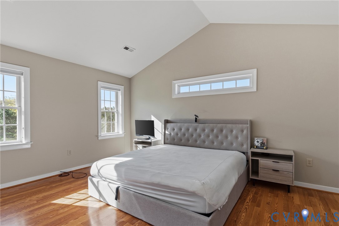 15286 Devonwood Road Montpelier, VA 23192 - Photo 44 of 50 Bedroom featuring lofted ceiling, light wood finis