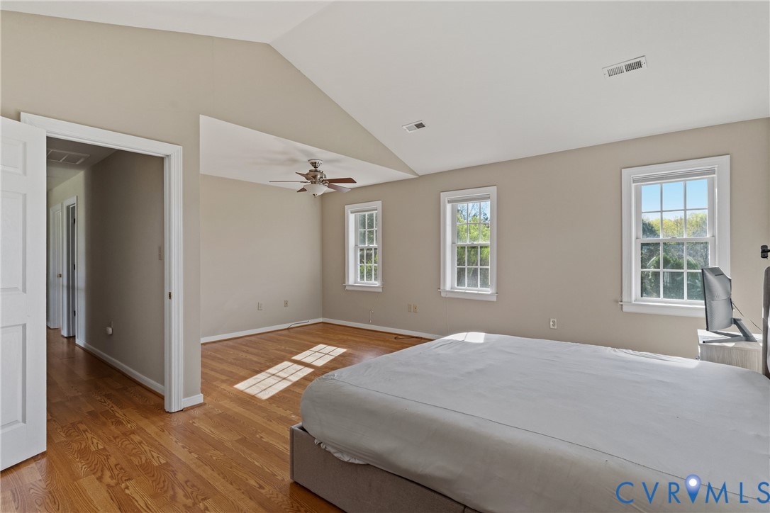 15286 Devonwood Road Montpelier, VA 23192 - Photo 45 of 50 Bedroom with vaulted ceiling, light wood-style flo