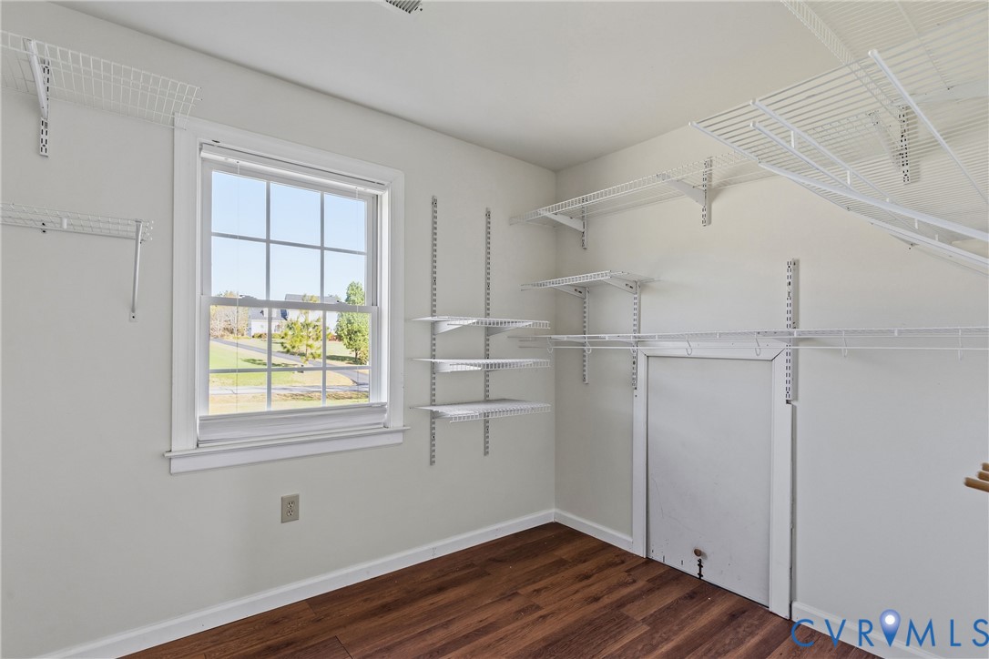 15286 Devonwood Road Montpelier, VA 23192 - Photo 49 of 50 Walk in closet with dark wood finished floors