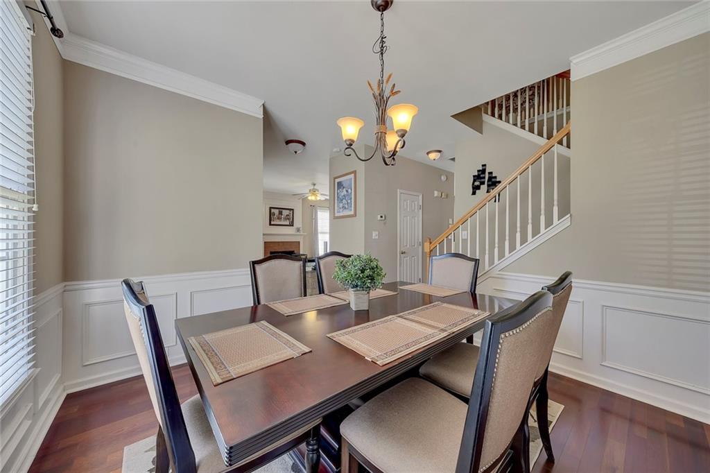 785 Hedgewick Trail Alpharetta, GA 30022 - Photo 11 of 32 a view of a dining room with furniture window and wooden floor