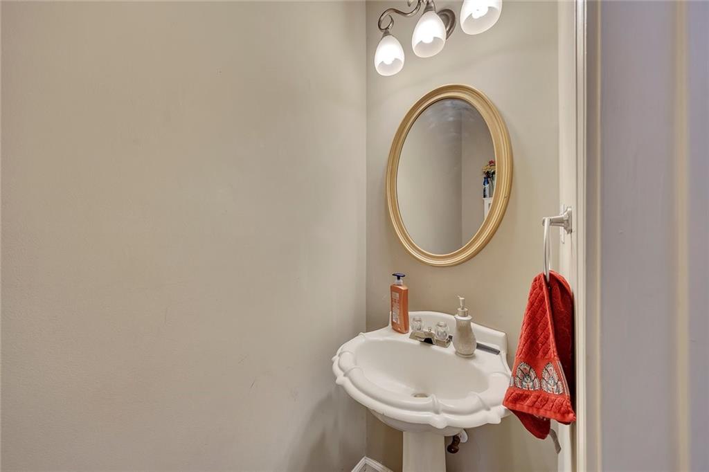 785 Hedgewick Trail Alpharetta, GA 30022 - Photo 17 of 32 a bathroom with a sink and a mirror