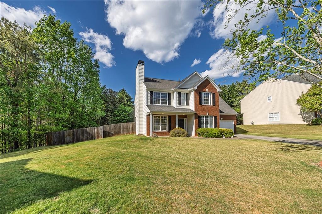 785 Hedgewick Trail Alpharetta, GA 30022 - Photo 2 of 32 a front view of a house with a yard