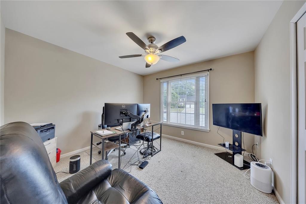 785 Hedgewick Trail Alpharetta, GA 30022 - Photo 25 of 32 a living room with furniture and a window