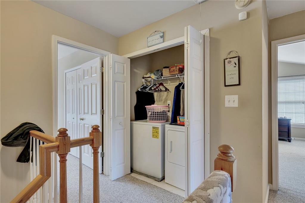 785 Hedgewick Trail Alpharetta, GA 30022 - Photo 26 of 32 a view of a hallway with a view of bedroom