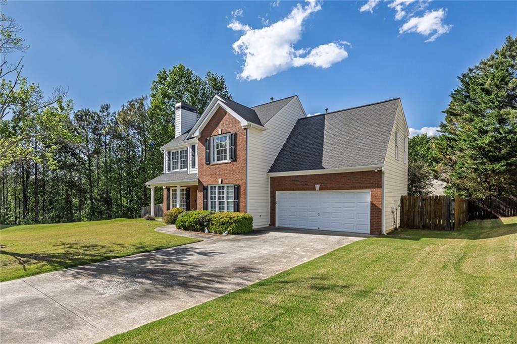 785 Hedgewick Trail Alpharetta, GA 30022 - Photo 3 of 32 a front view of a house with a yard
