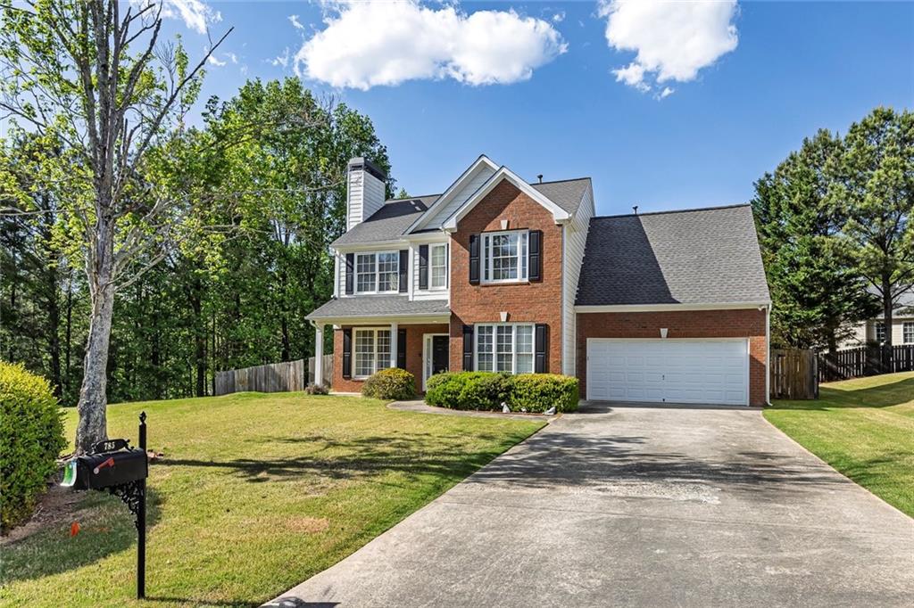 785 Hedgewick Trail Alpharetta, GA 30022 - Photo 4 of 32 a front view of a house with garden