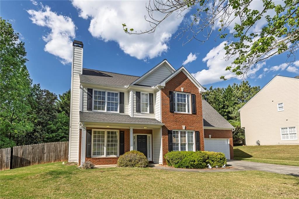 785 Hedgewick Trail Alpharetta, GA 30022 - Photo 5 of 32 a front view of a house with a yard