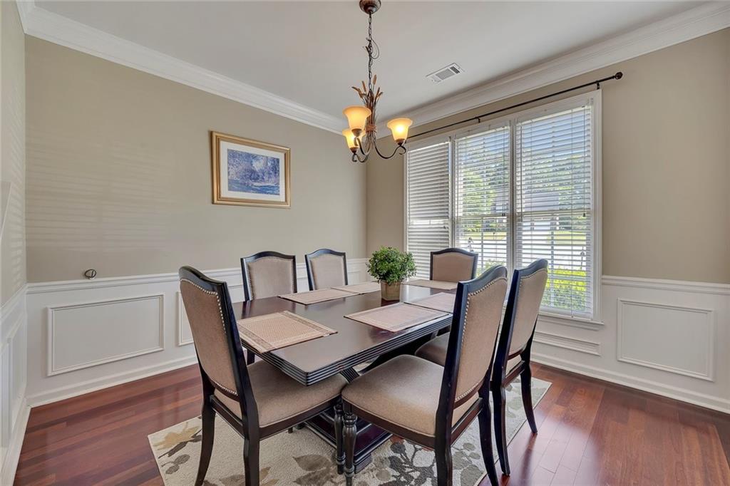 785 Hedgewick Trail Alpharetta, GA 30022 - Photo 10 of 32 a view of a dining room with furniture window and wooden floor