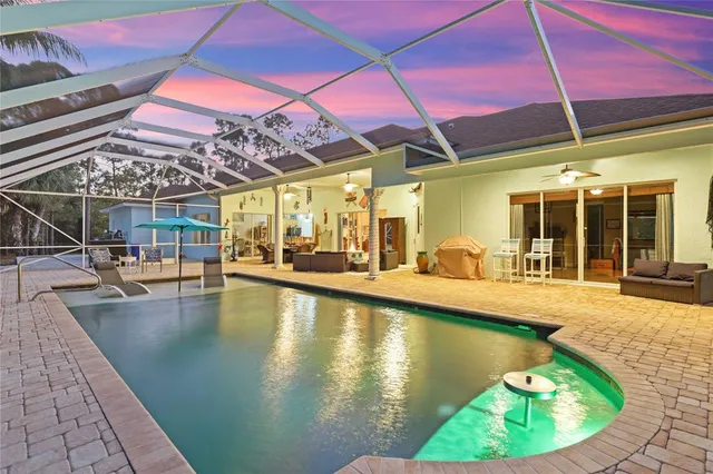 a view of a swimming pool with a patio