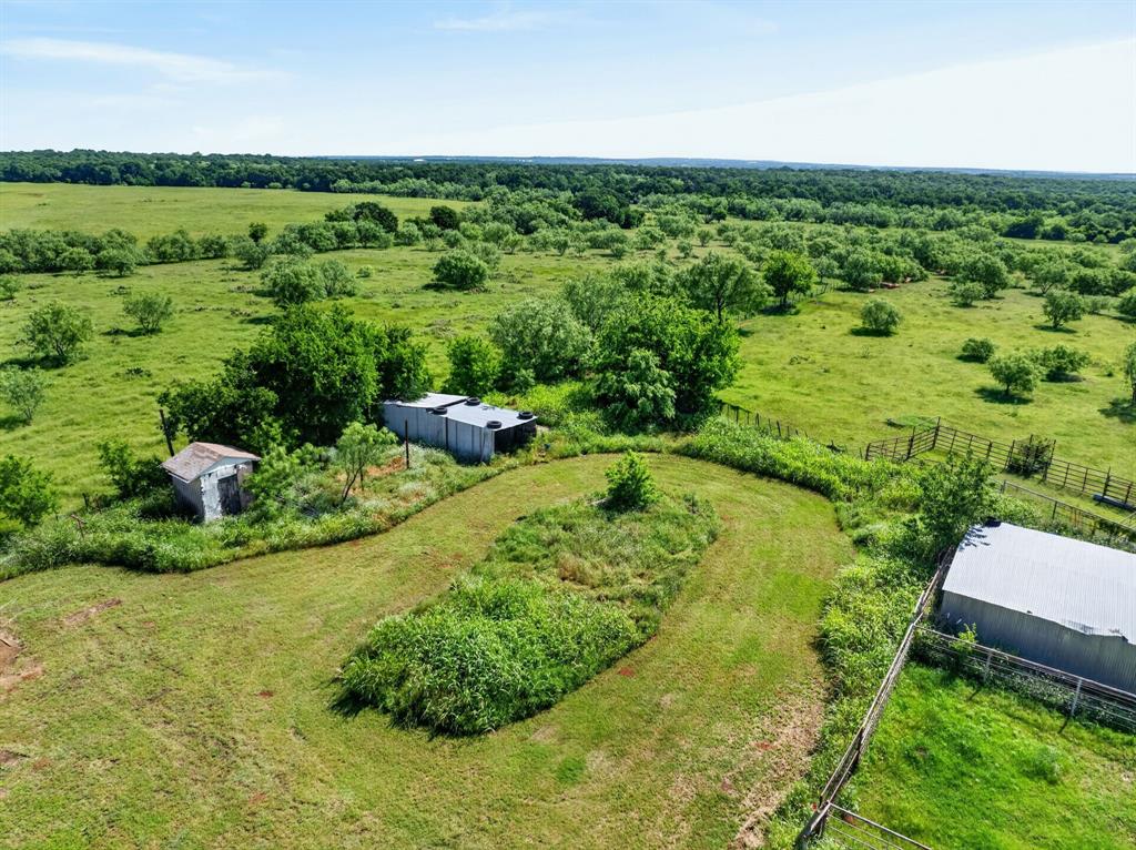 2401 Lamkin Road Mineral Wells, TX 76067 - Photo 32 of 36 a view of a lush green field