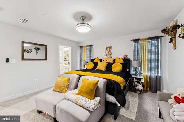 a bed room with a bed and a couch