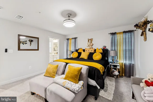 a bed room with a bed and a couch