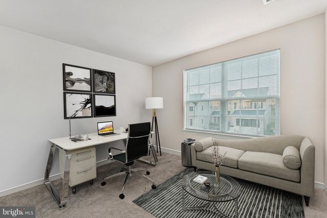 a work room with furniture and windows