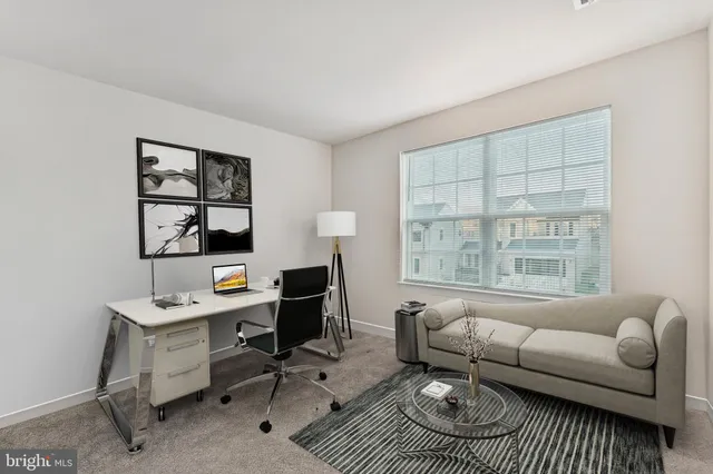 a work room with furniture and windows