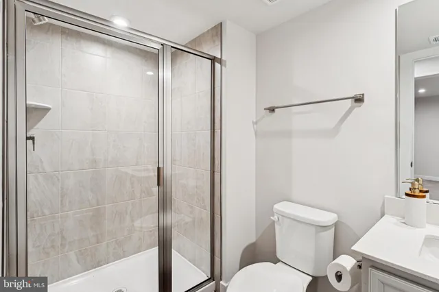 a bathroom with a shower and a toilet