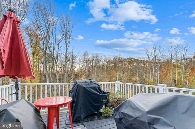 a view of a chair and table in the balcony