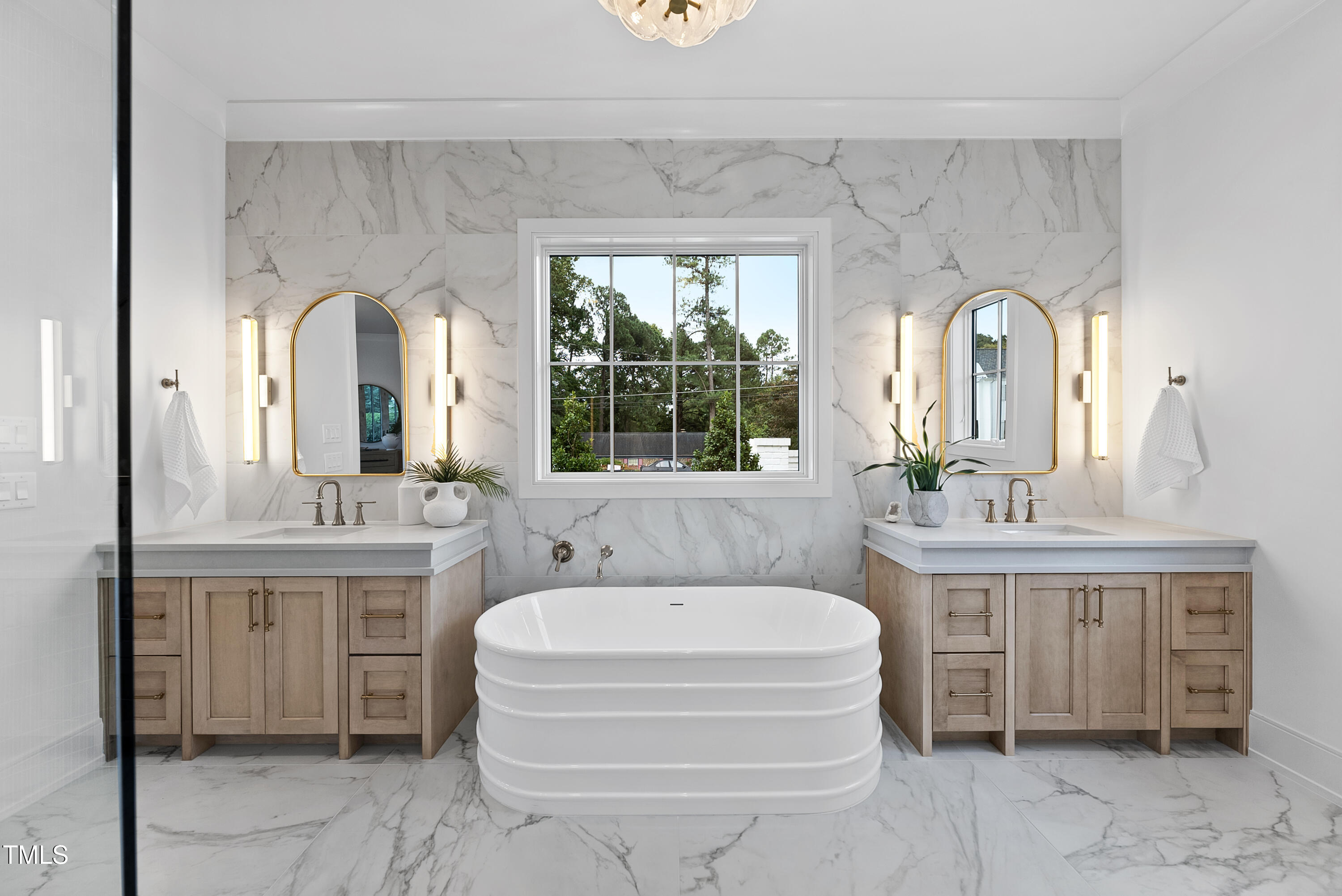 3300 Founding Place Raleigh, NC 27612 - Photo 45 of 100 a en suite bathroom with a double vanity sink a mirror and a bathtub