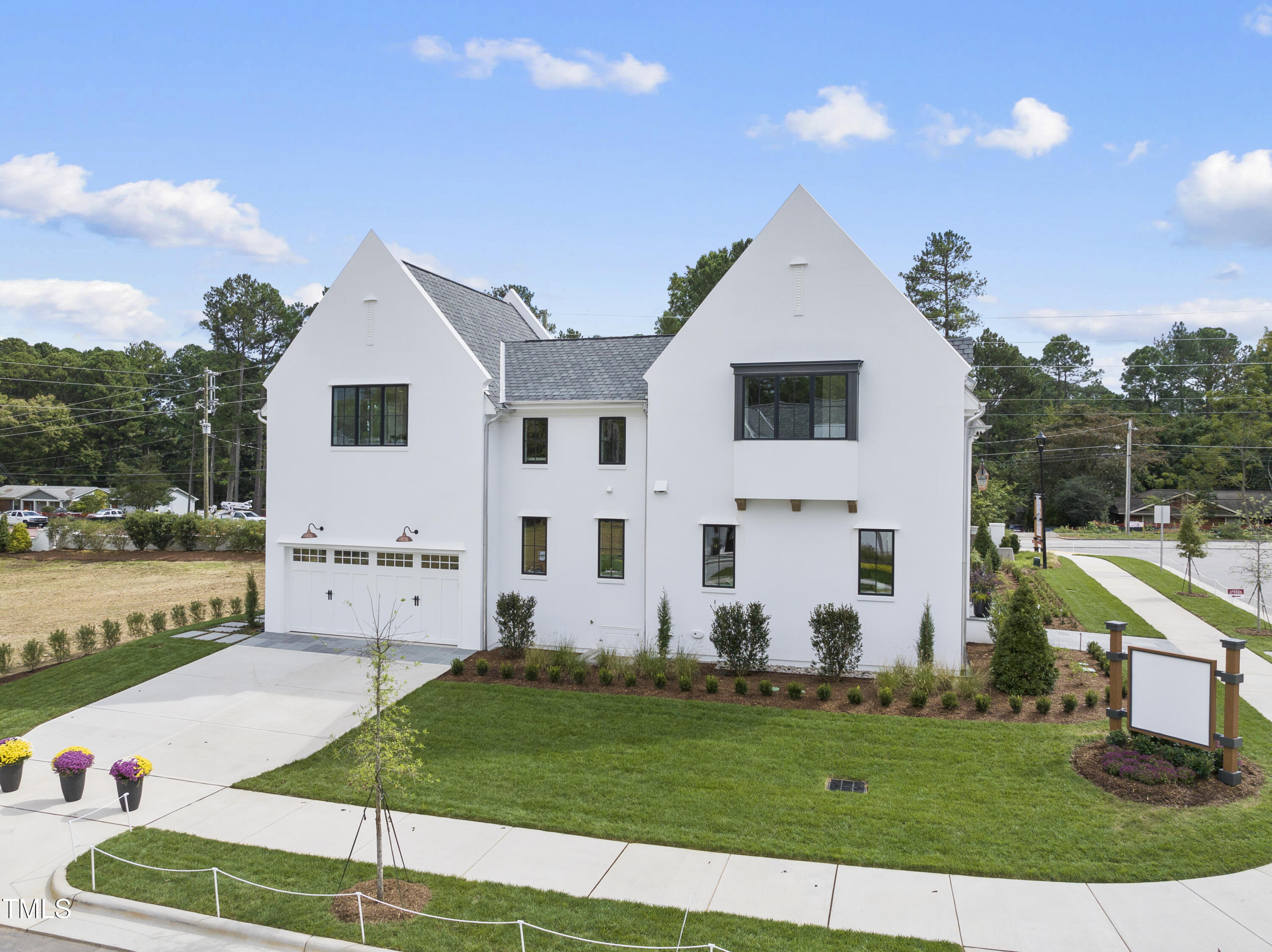 3300 Founding Place Raleigh, NC 27612 - Photo 5 of 100 a front view of a house with a yard and garage