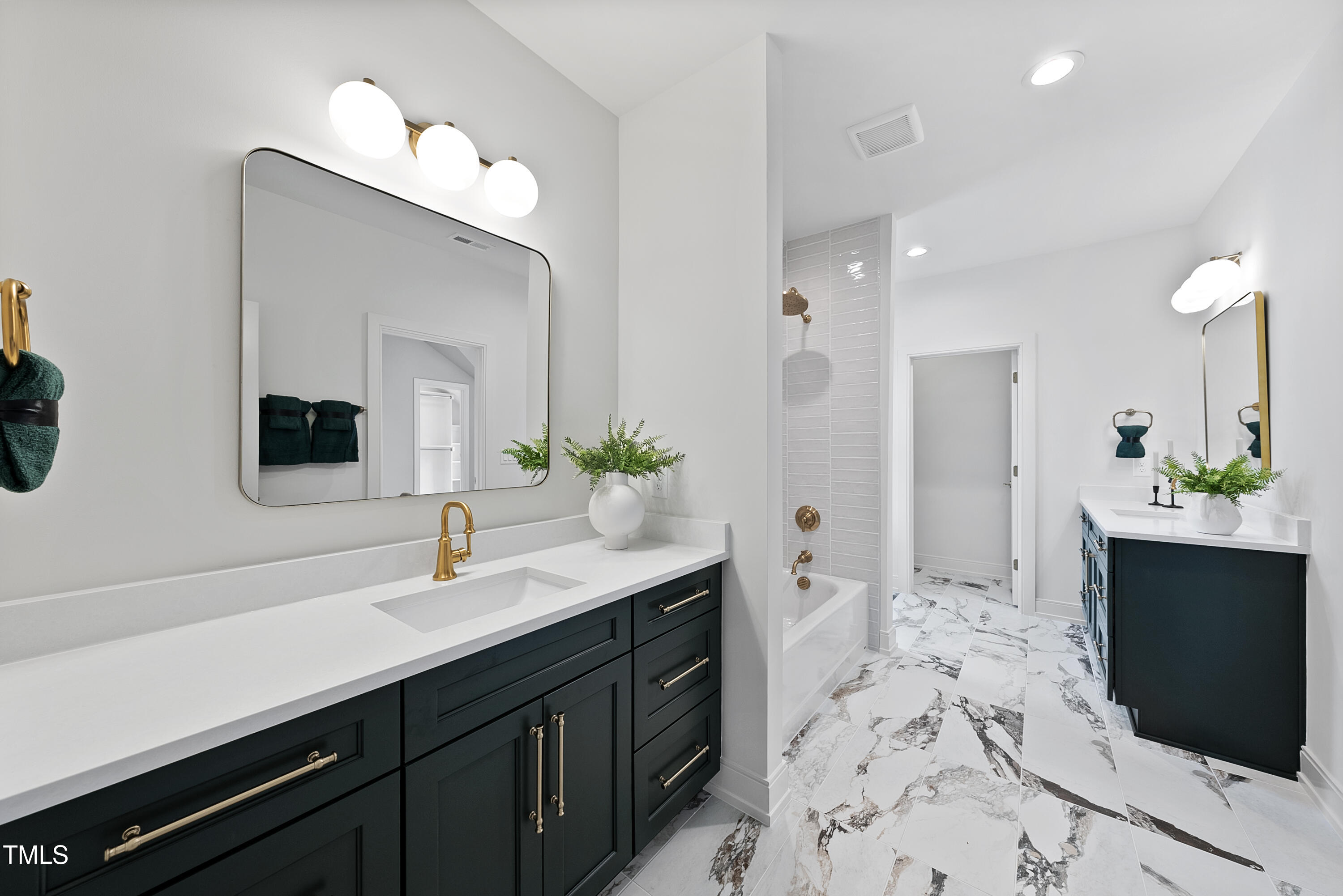 3300 Founding Place Raleigh, NC 27612 - Photo 55 of 100 a spacious bathroom with a double vanity sink a mirror and a shower