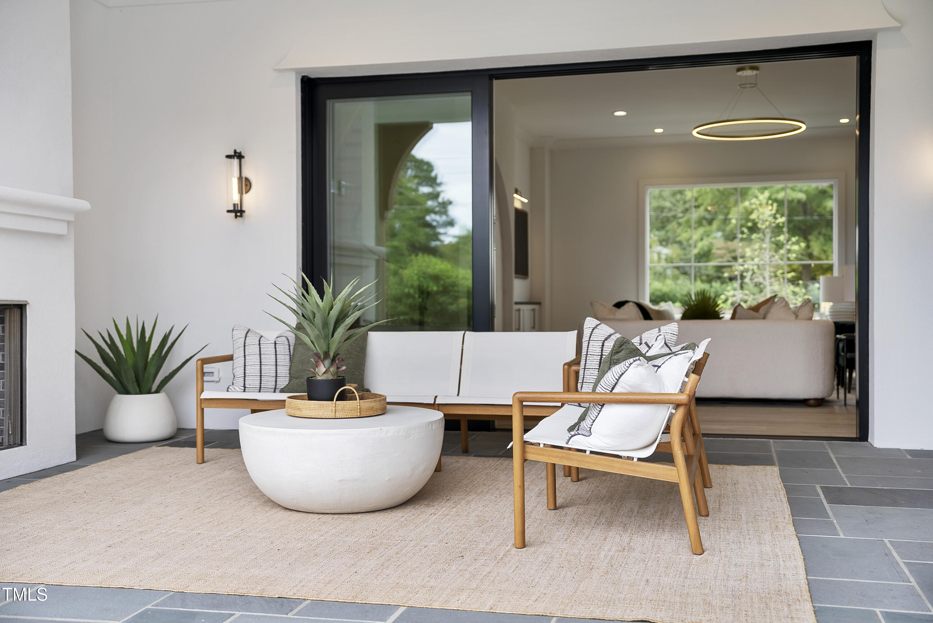 3300 Founding Place Raleigh, NC 27612 - Photo 91 of 100 a living room with a couch and a potted plant
