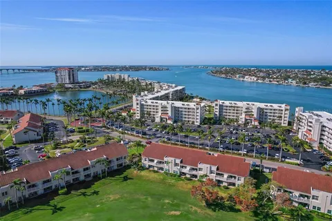 an aerial view of city and lake