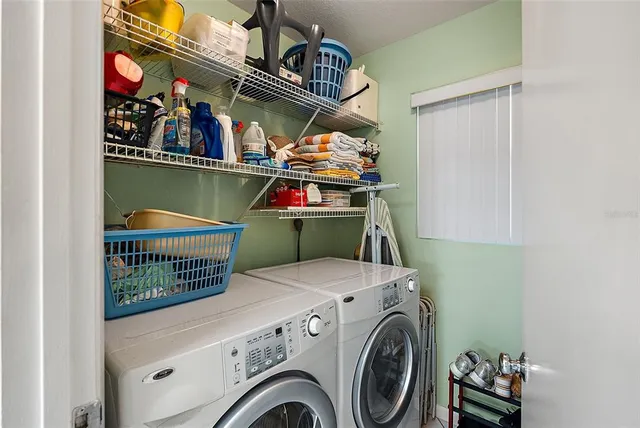 a utility room with dryer and washer
