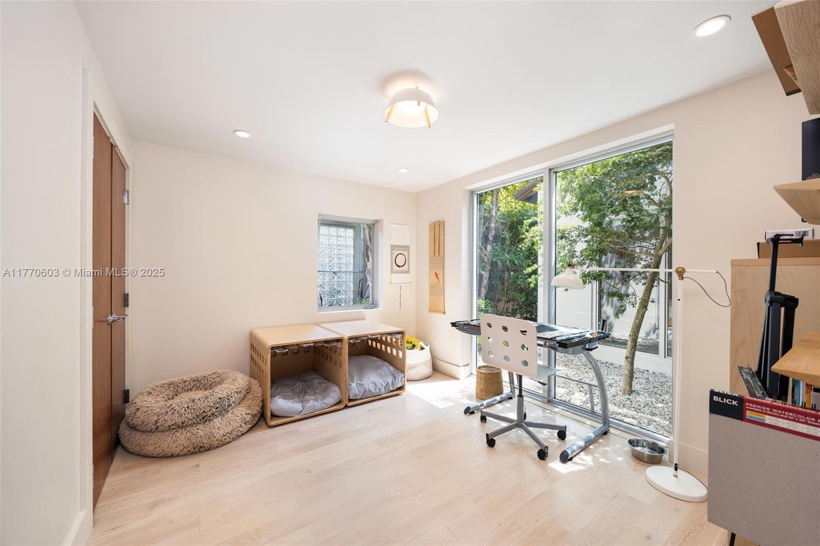 4140 Battersea Road Coconut Grove, FL 33133 - Photo 14 of 37 a room with furniture and a large window