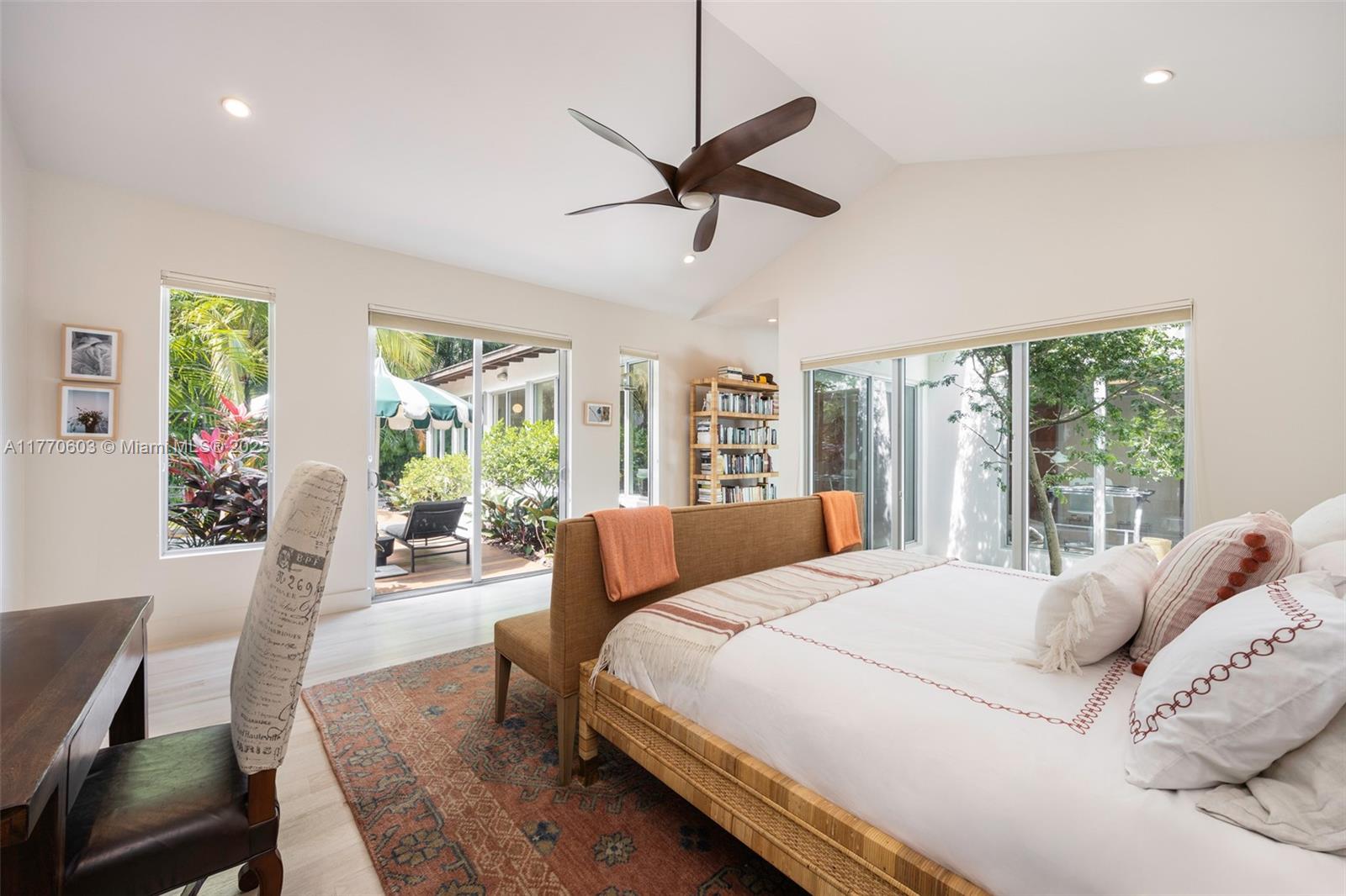 4140 Battersea Road Coconut Grove, FL 33133 - Photo 15 of 37 a bedroom with a large bed and a large window