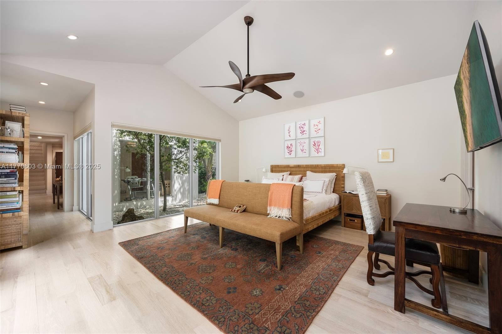 4140 Battersea Road Coconut Grove, FL 33133 - Photo 16 of 37 a living room with furniture a piano and a flat screen tv