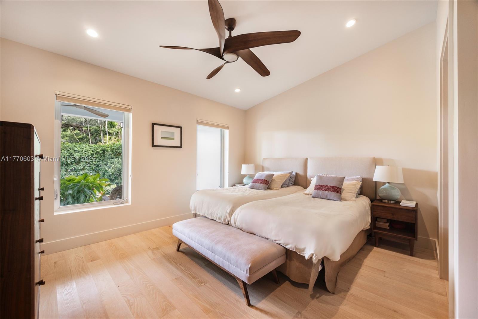 4140 Battersea Road Coconut Grove, FL 33133 - Photo 18 of 37 a bedroom with furniture and a large window