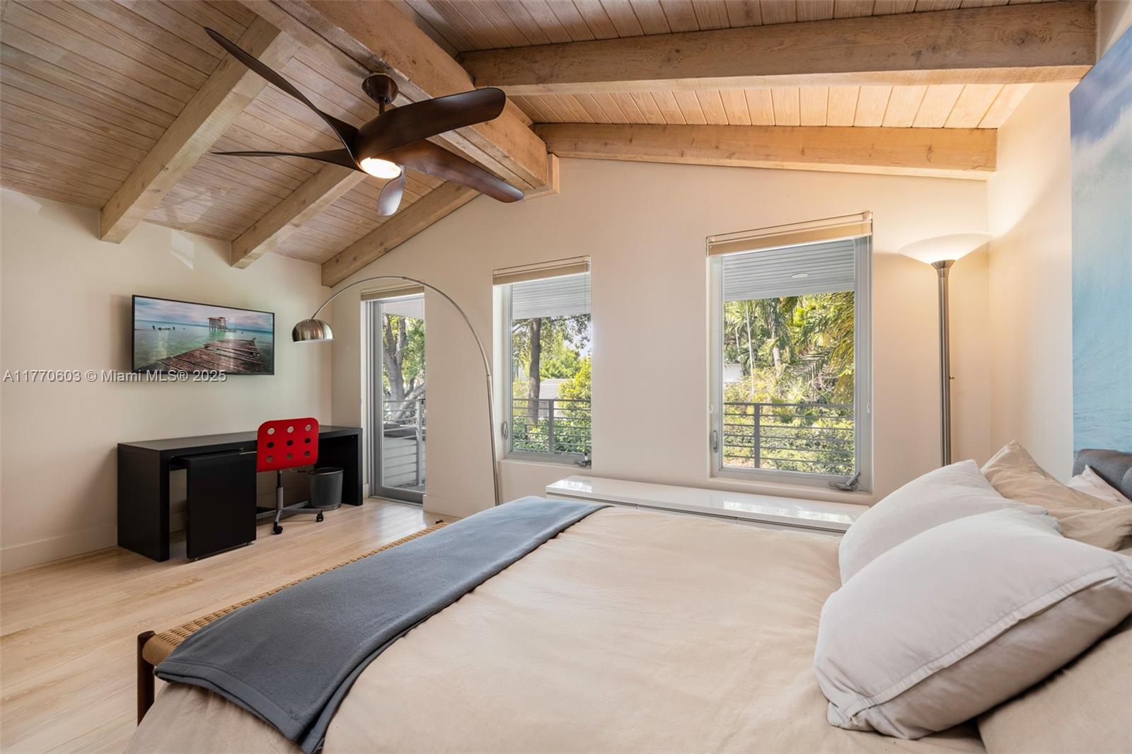 4140 Battersea Road Coconut Grove, FL 33133 - Photo 20 of 37 a bedroom with a bed and a flat screen tv