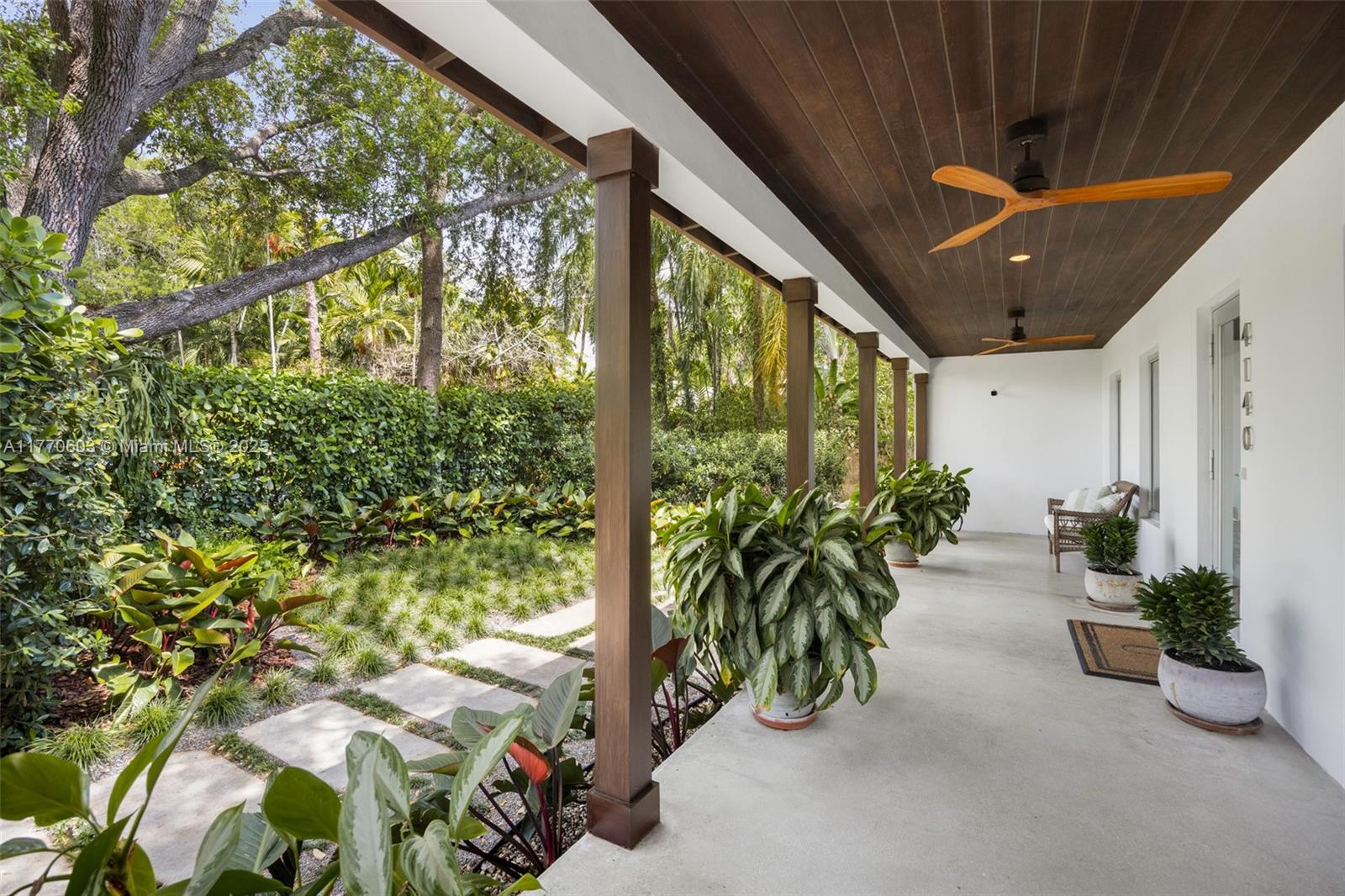 4140 Battersea Road Coconut Grove, FL 33133 - Photo 2 of 37 a couple of flower plants in front of building