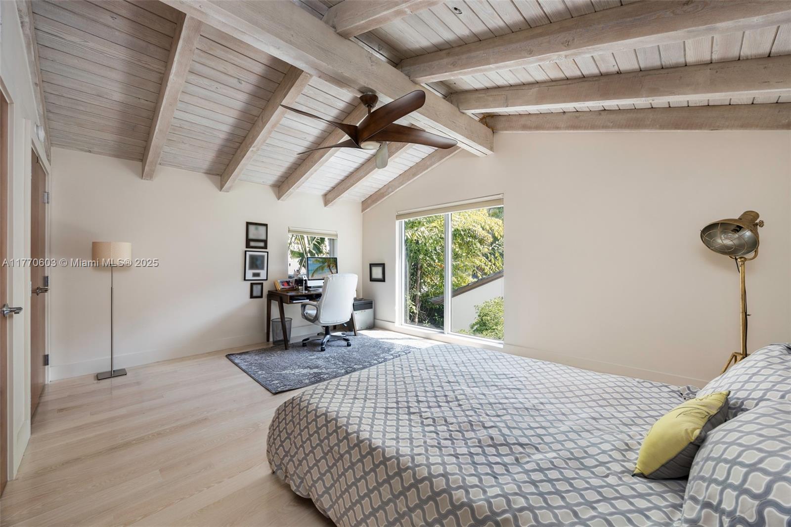 4140 Battersea Road Coconut Grove, FL 33133 - Photo 22 of 37 a bed sitting in a bedroom next to a window