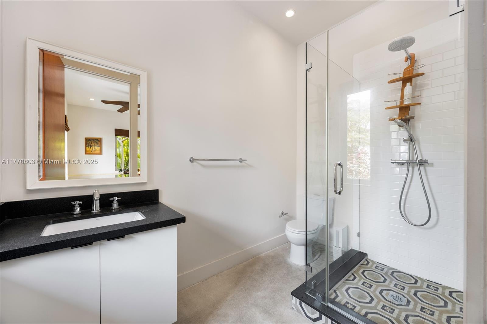 4140 Battersea Road Coconut Grove, FL 33133 - Photo 26 of 37 a bathroom with a sink and a mirror