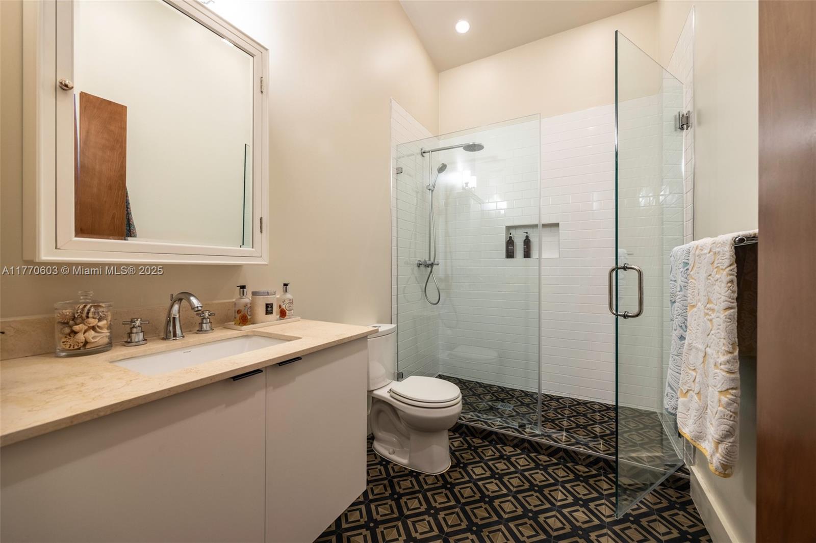 4140 Battersea Road Coconut Grove, FL 33133 - Photo 27 of 37 a bathroom with a sink toilet and shower