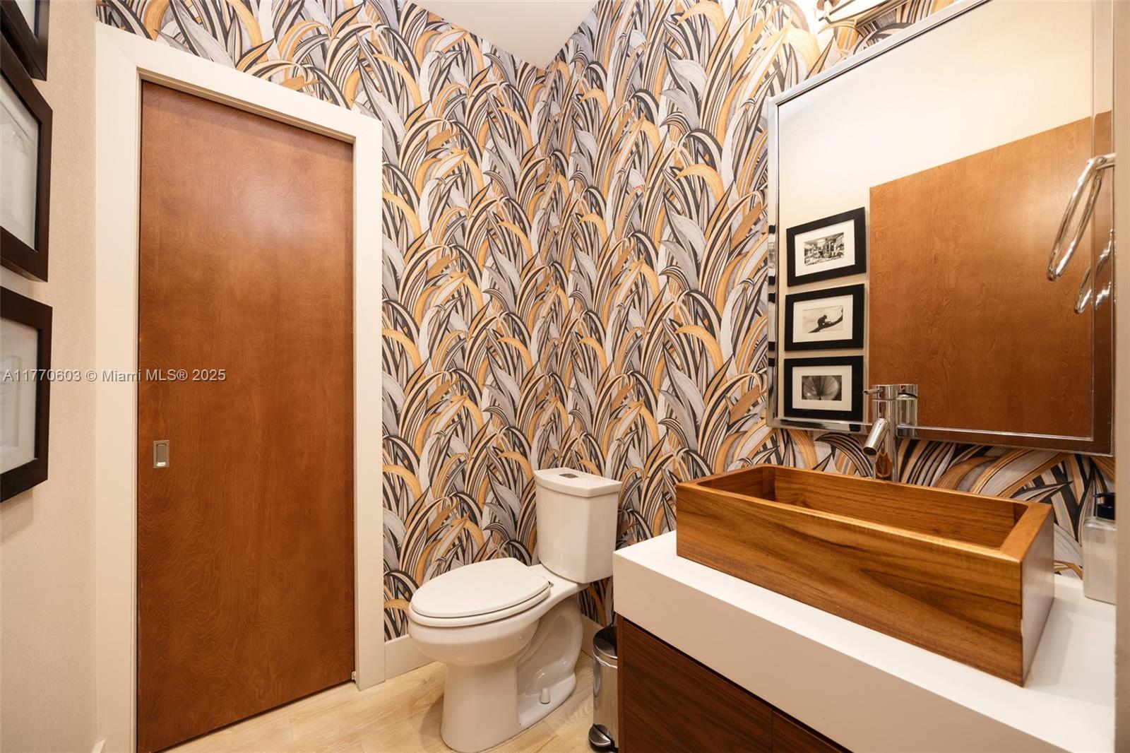 4140 Battersea Road Coconut Grove, FL 33133 - Photo 29 of 37 a bathroom with a toilet and a shower curtain