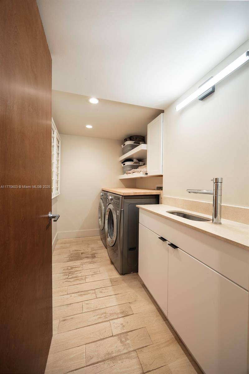 4140 Battersea Road Coconut Grove, FL 33133 - Photo 30 of 37 a kitchen with a stove a sink and a refrigerator