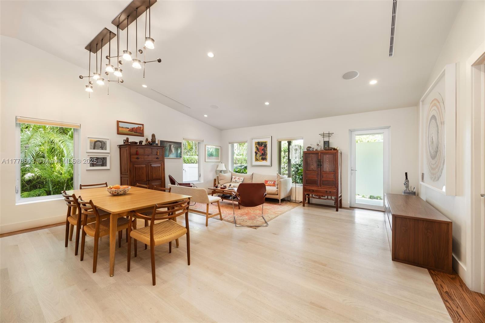 4140 Battersea Road Coconut Grove, FL 33133 - Photo 3 of 37 a view of a dining room with furniture window and wooden floor
