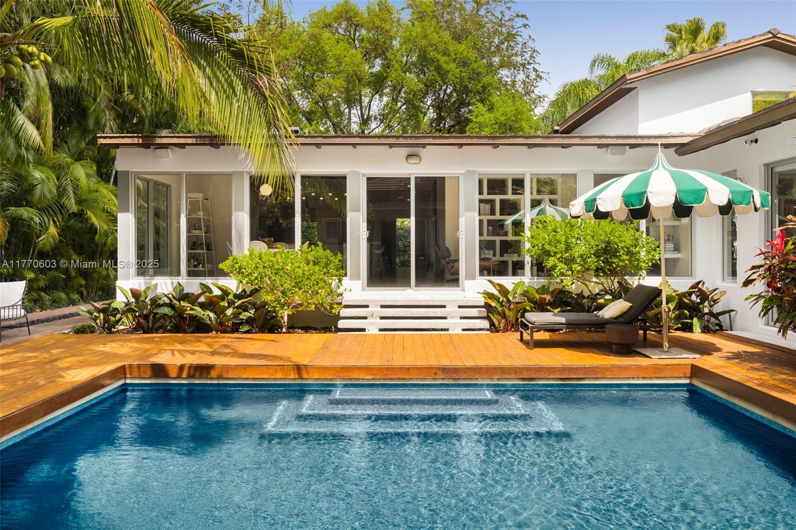 4140 Battersea Road Coconut Grove, FL 33133 - Photo 35 of 37 a view of a house with swimming pool and porch with furniture