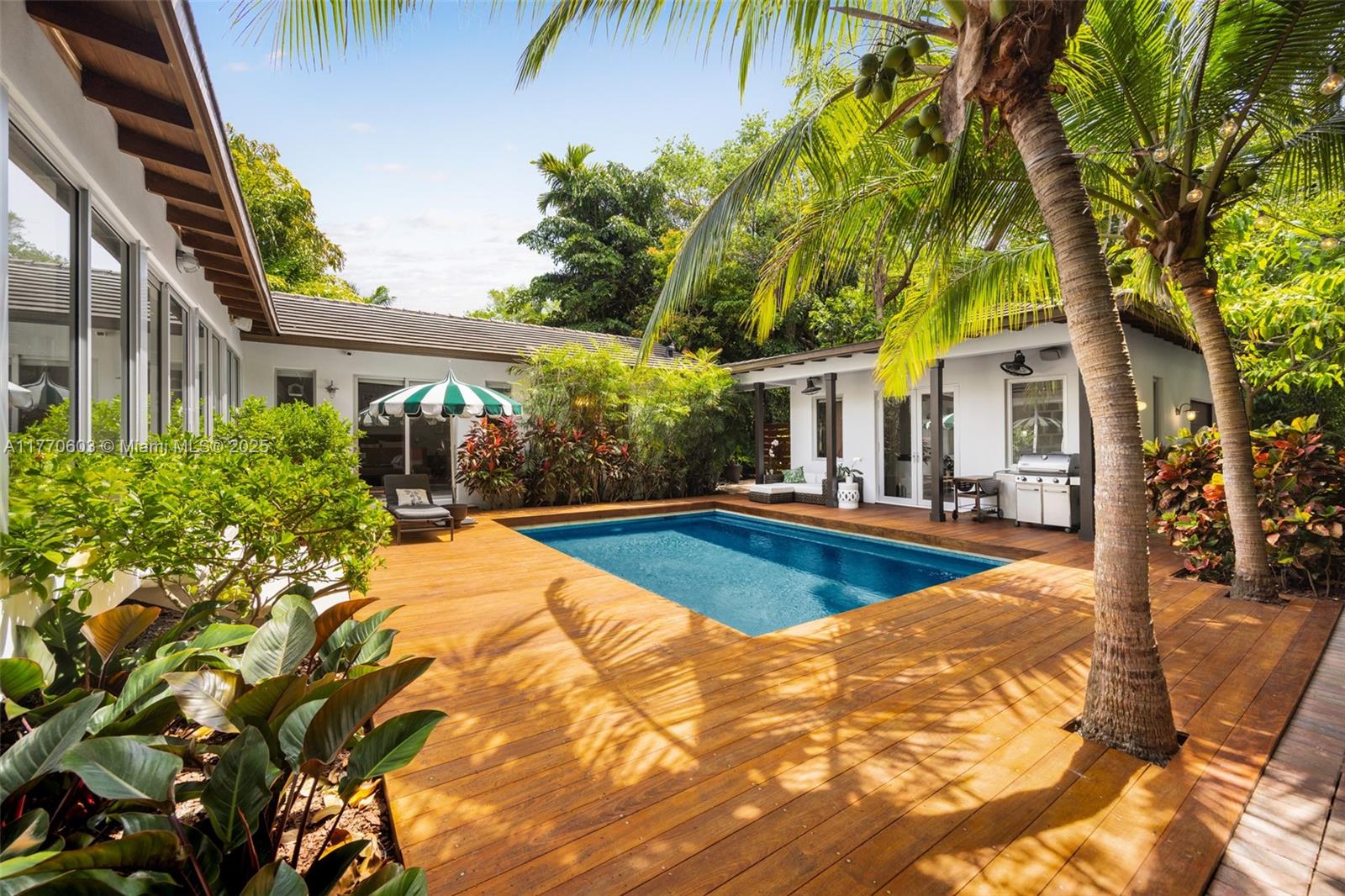 4140 Battersea Road Coconut Grove, FL 33133 - Photo 37 of 37 a view of a house with pool and sitting area