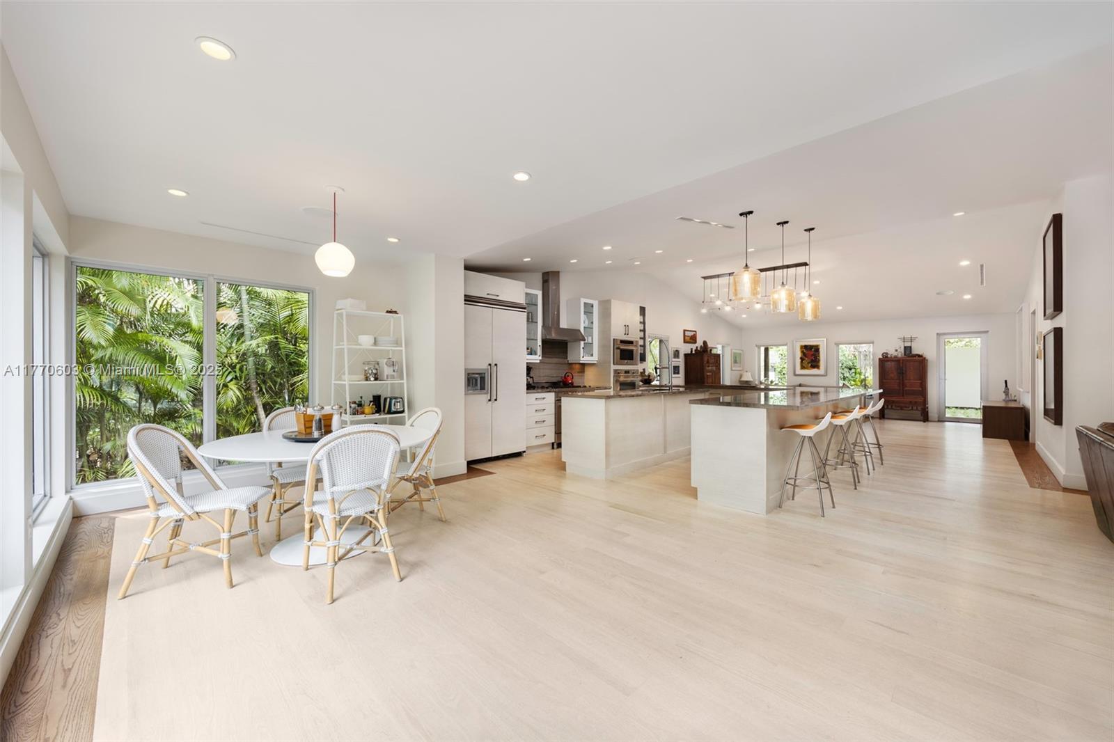 4140 Battersea Road Coconut Grove, FL 33133 - Photo 7 of 37 a living room with furniture and a table