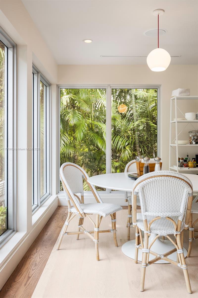 4140 Battersea Road Coconut Grove, FL 33133 - Photo 8 of 37 a view of a dining room with furniture window and outside view
