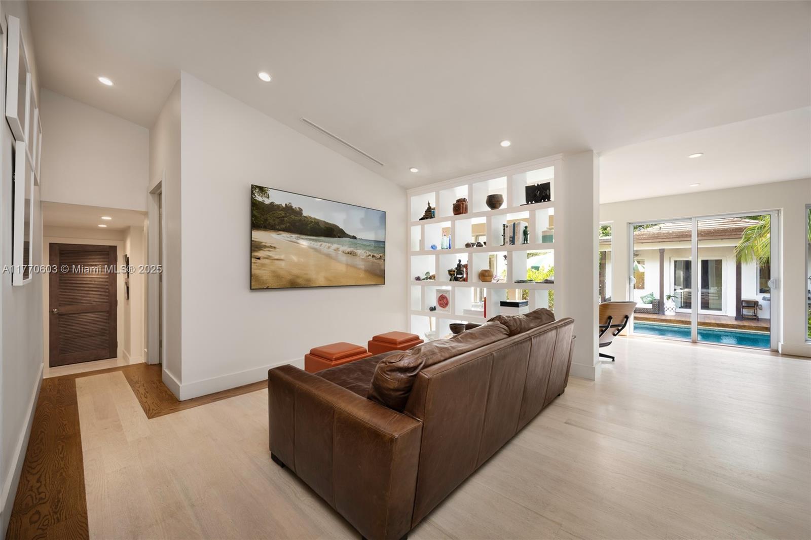 4140 Battersea Road Coconut Grove, FL 33133 - Photo 9 of 37 a living room with furniture and a flat screen tv