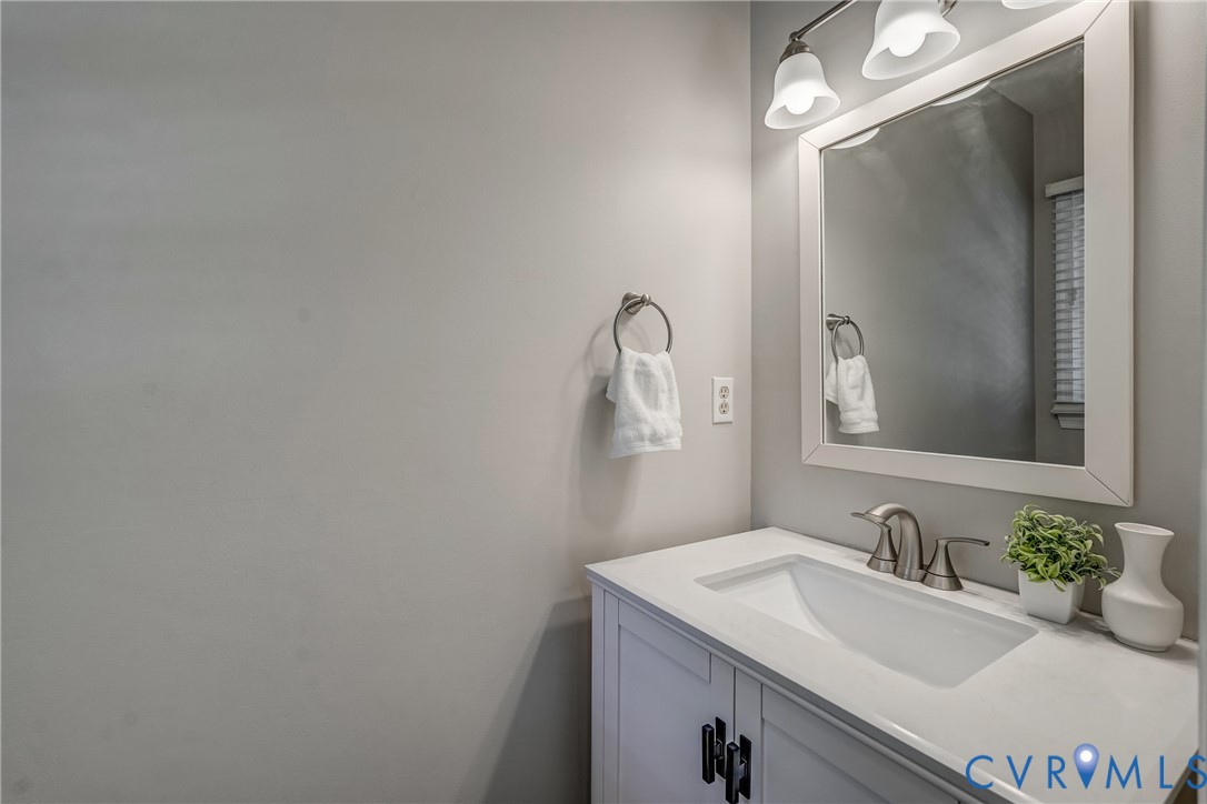 5016 Eddings Drive Glen Allen, VA 23060 - Photo 11 of 22 a bathroom with a sink and a mirror