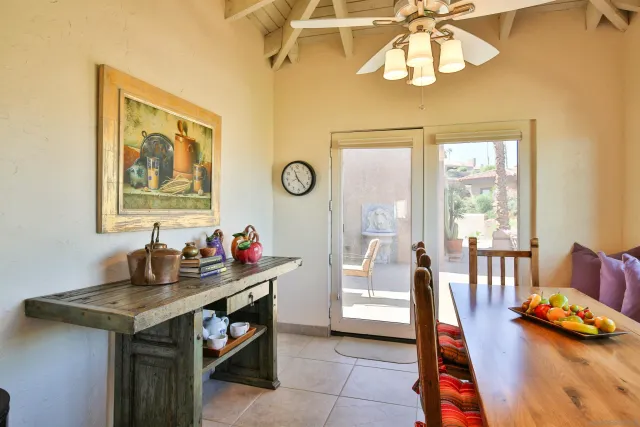 a view of a dining room with furniture window and outside view