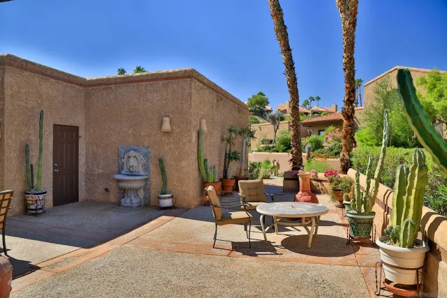 a outdoor space with a couch and chairs