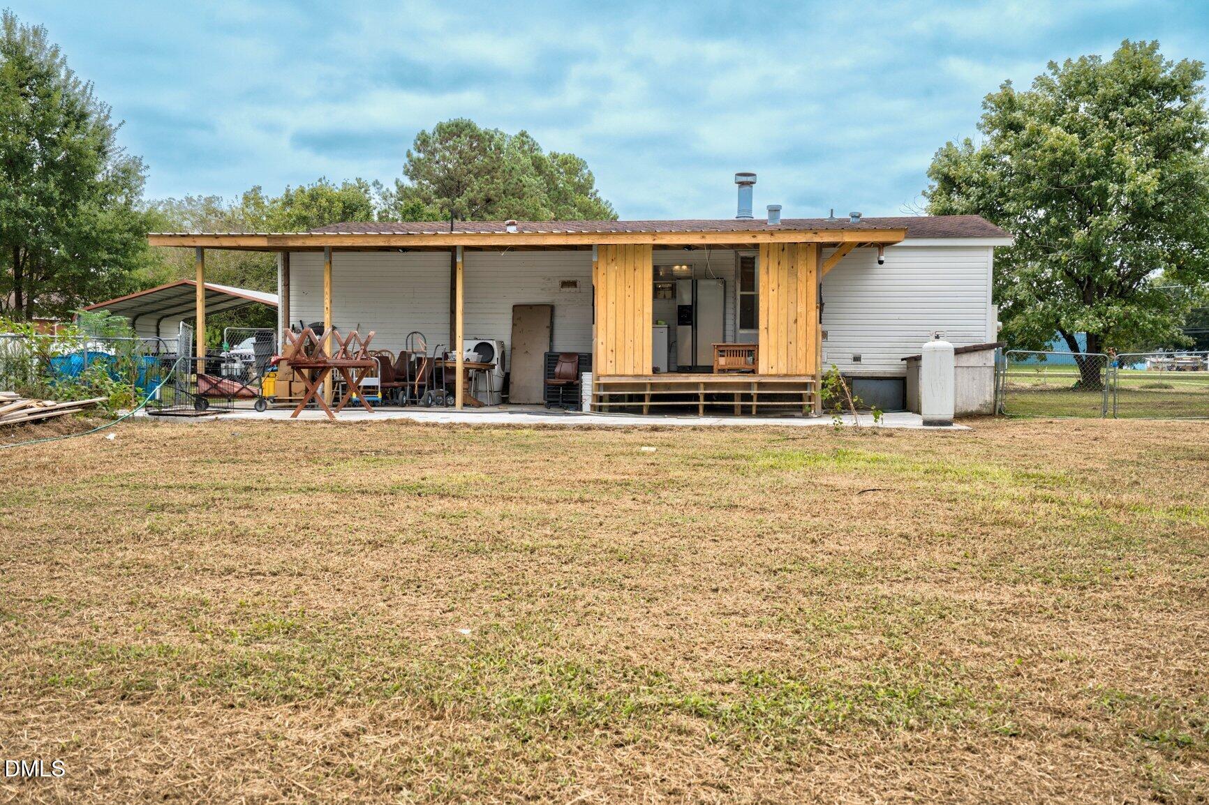 1835 Cokey Road Rocky Mount, NC 27801 - Photo 25 of 42 front view of a house with a patio