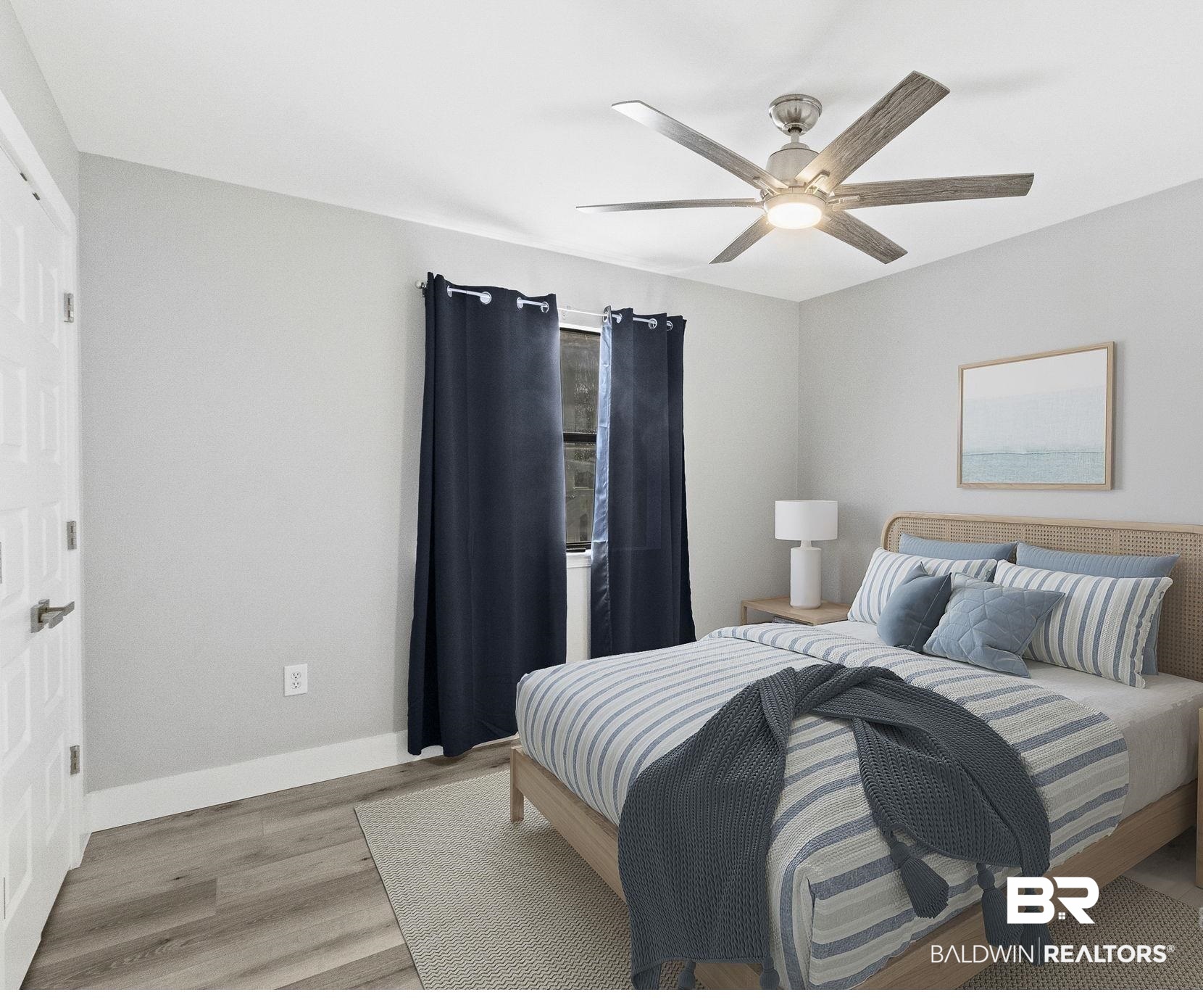 25861 Canal Road, Unit 77 Orange Beach, AL 36561 - Photo 30 of 48 Bedroom featuring light wood finished floors and ceiling fan
